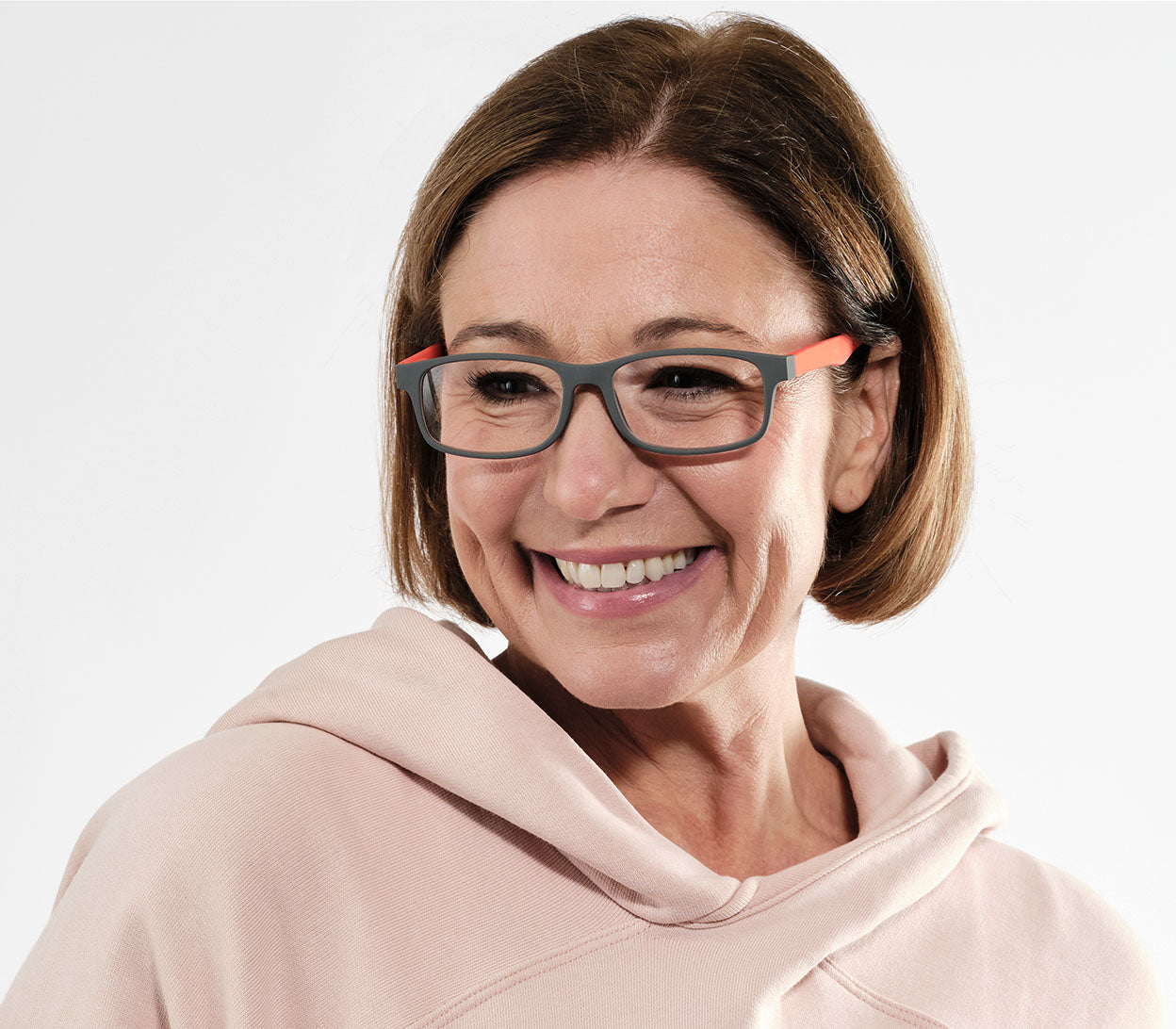 Female model wearing Bounce (Orange) unisex reading glasses with two tone, classic shape frame.