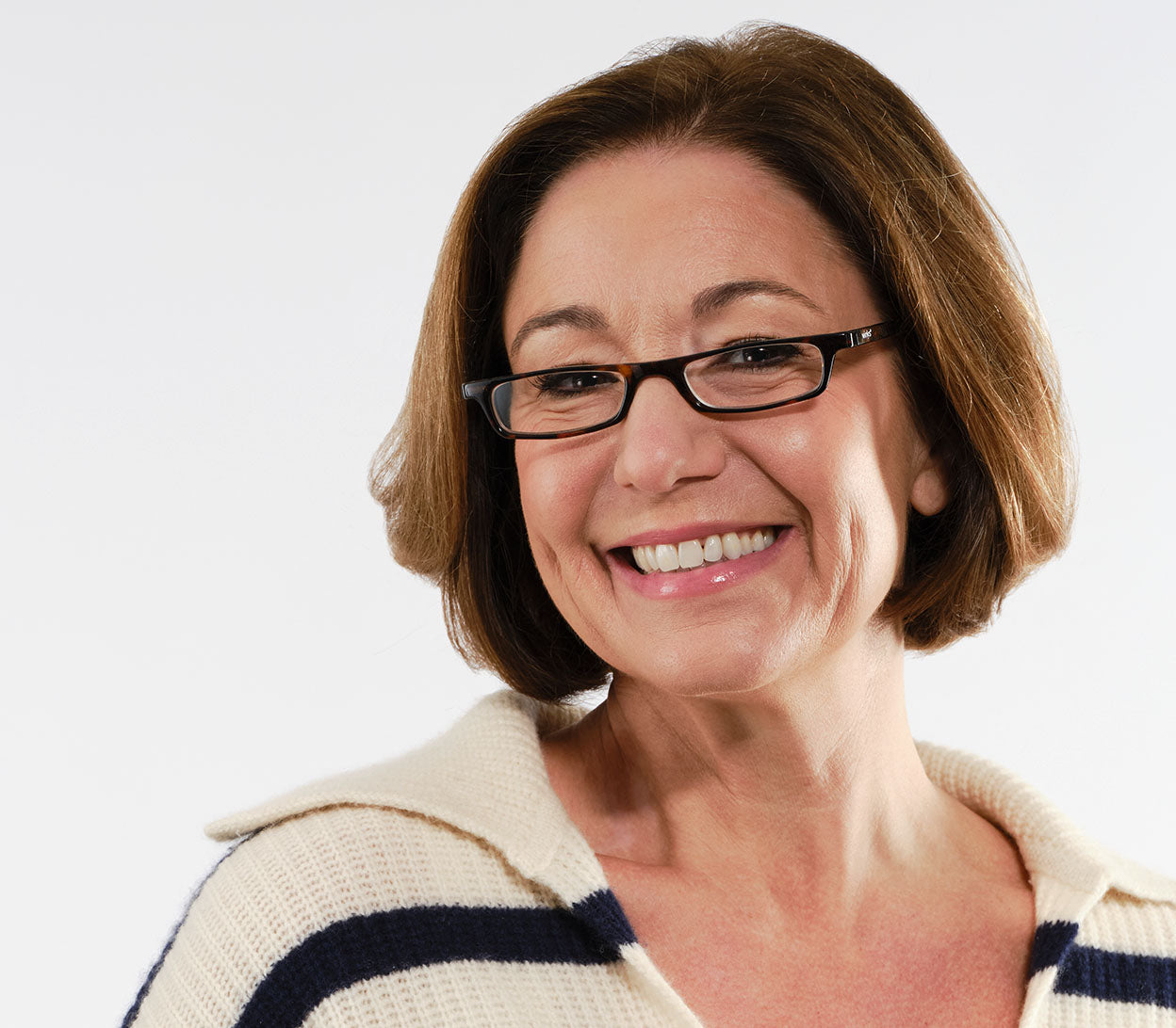 Female model wearing Mylo (Tortoiseshell) classic shape, slim reading glasses with dark tortoiseshell glossy frames.