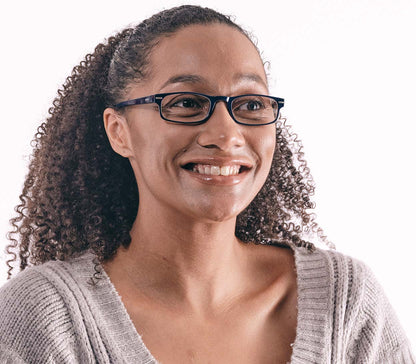 Female model wearing London (Blue) classic rectangular and slim unisex reading glasses in a deep blue glossy finish.