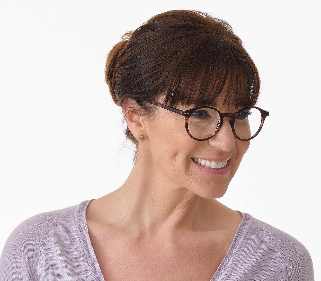 Female model wearing Oskar (Tortoiseshell) unisex reading glasses with large round lenses and soft touch deep tortoiseshell frames.