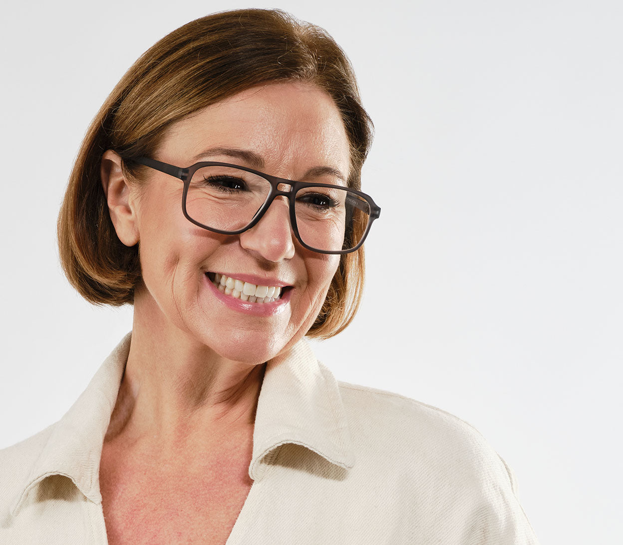 Female model wearing Magnum (Grey) oversized, aviator style unisex reading glasses with a soft touch finish.