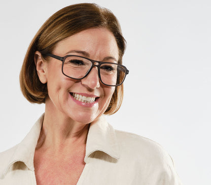 Female model wearing Magnum (Grey) oversized, aviator style unisex reading glasses with a soft touch finish.