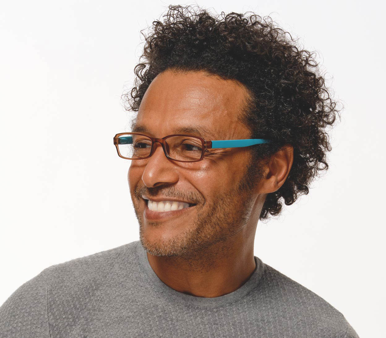 Male model wearing Hangover (Brown) unisex reading glasses with long arms for hanging around your neck. Turquoise arms and contrasting brown frames.