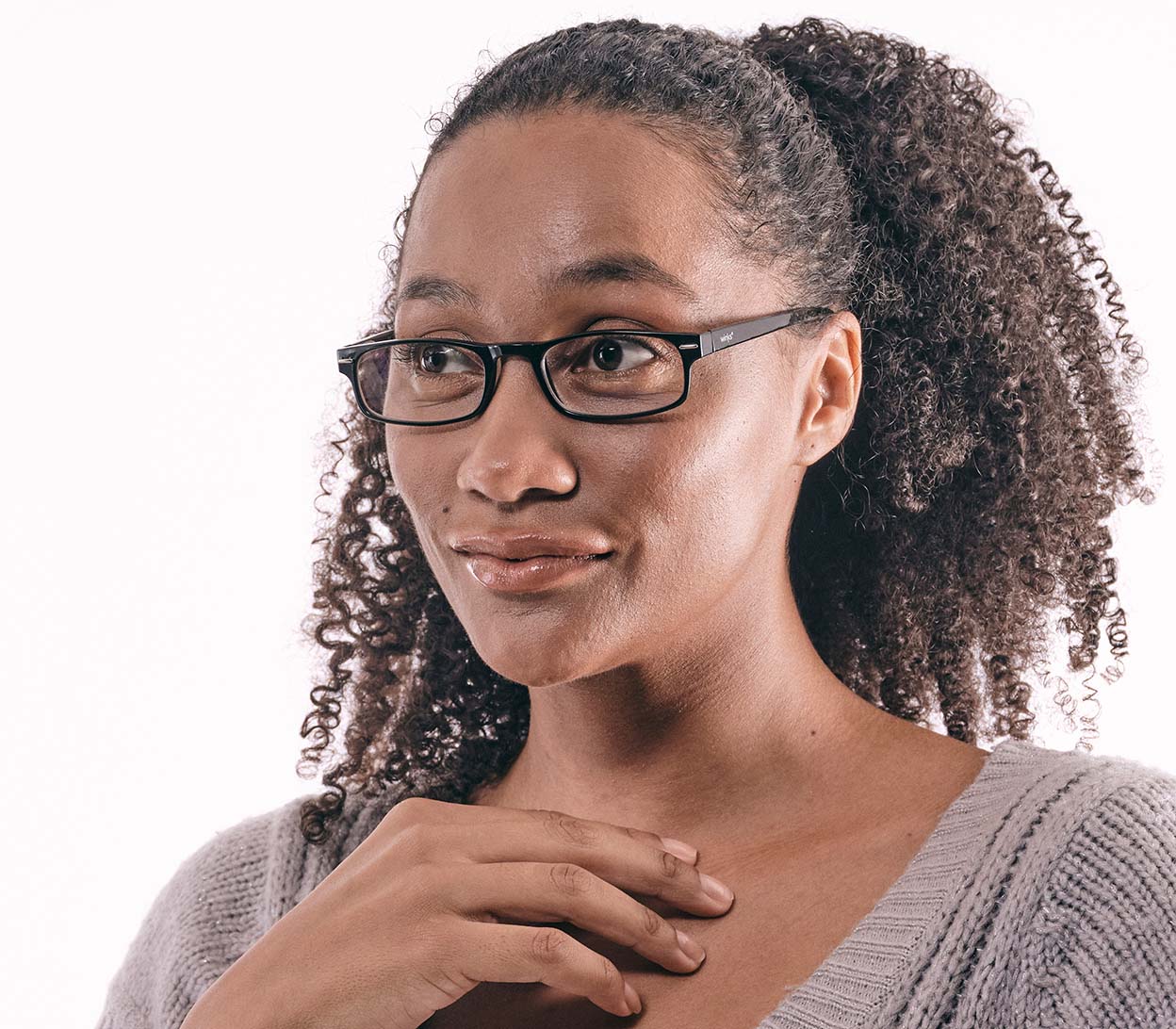 Female model wearing London Digital (Black) classic rectangular and slim unisex blue light reading glasses in a glossy black finish.
