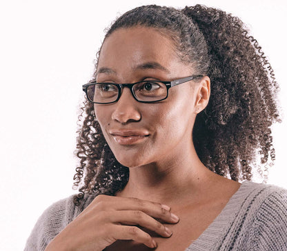 Female model wearing London Digital (Black) classic rectangular and slim unisex blue light reading glasses in a glossy black finish.