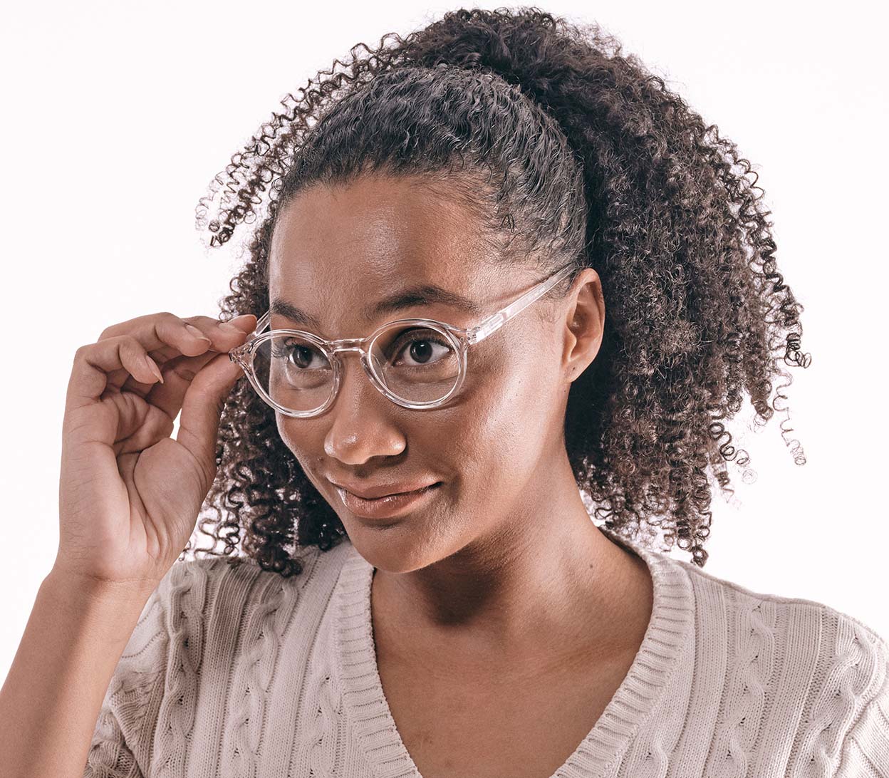 Female model wearing Oskar (Clear) unisex reading glasses with large round lenses and a clear frame.