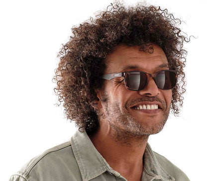 Soft glasses pouch with green and yellow stripes and Winks branding.