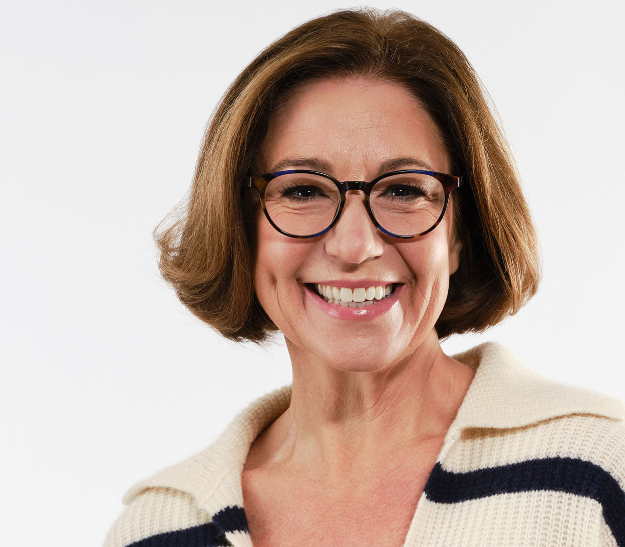 Female model wearing Marlow (Blue Tortoise) oval shaped reading glasses with a blue and brown tortoiseshell pattern and glossy finish.