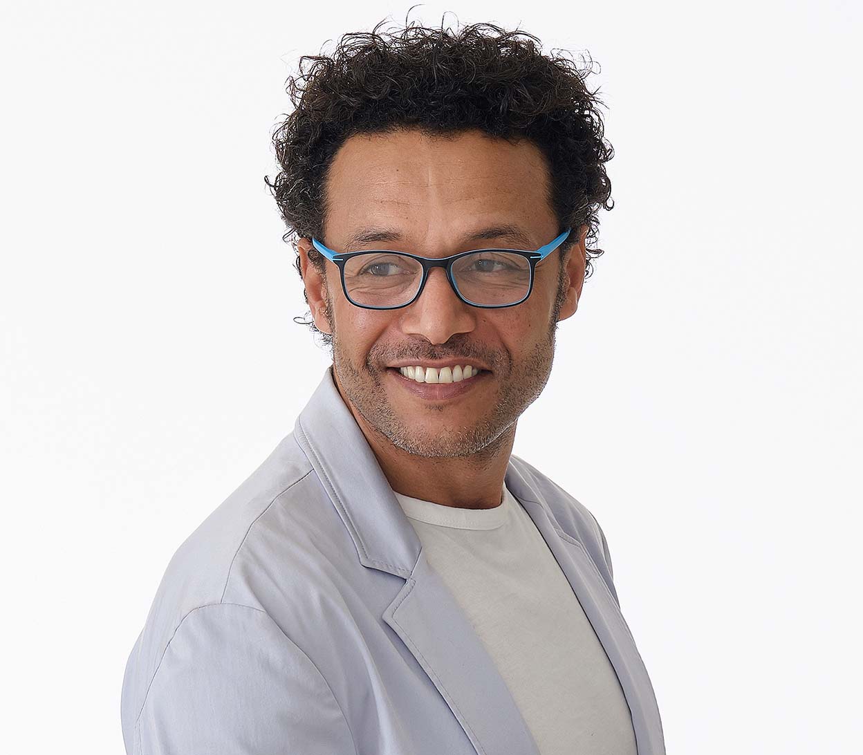 Male model wearing Jazz (Blue) classic shape reading glasses with rectangular lenses in a two tone blue and black frame.